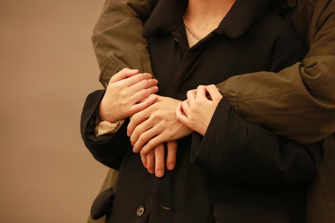 A couple sharing a gentle embrace, symbolising emotional closeness and how to restart intimacy after a long period of distance.