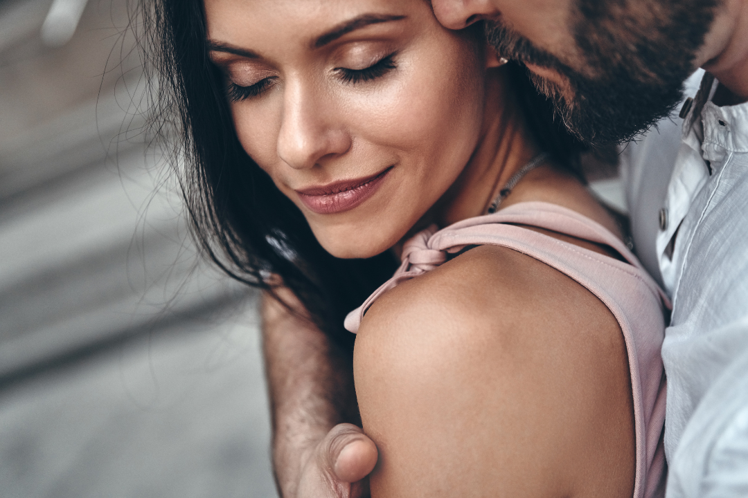 Couple in close intimate embrace showing emotional connection and physical closeness in long-term relationship